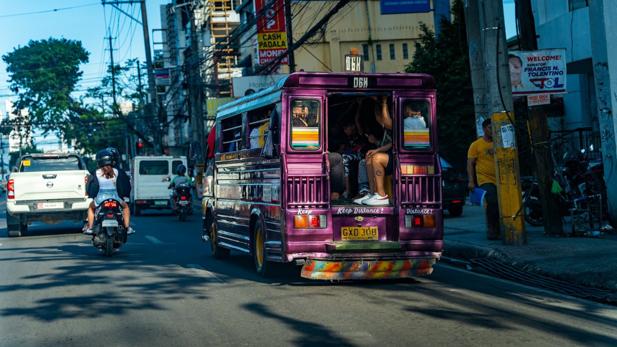 A jeepney driving through a Philippine street